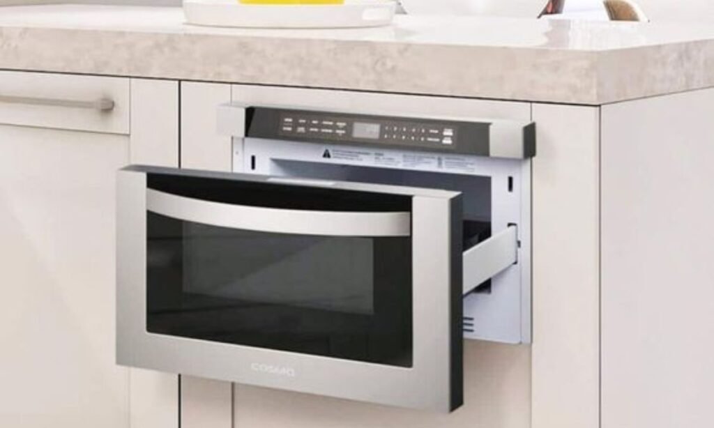 A modern kitchen showcasing a sleek microwave drawer installed beneath the countertop, blending seamlessly with the cabinetry.